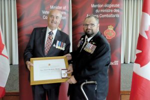 James MacMillan-Murphy was honoured for his work as a Peacekeeper, and his dedicated involvement in various veterans programs including the Editor and Founder of the Blue Beret newsletter, founder of the Canadian Peacekeeping Veterans Association, and his work with the Royal Canadian Legion. Bottom: The gath
