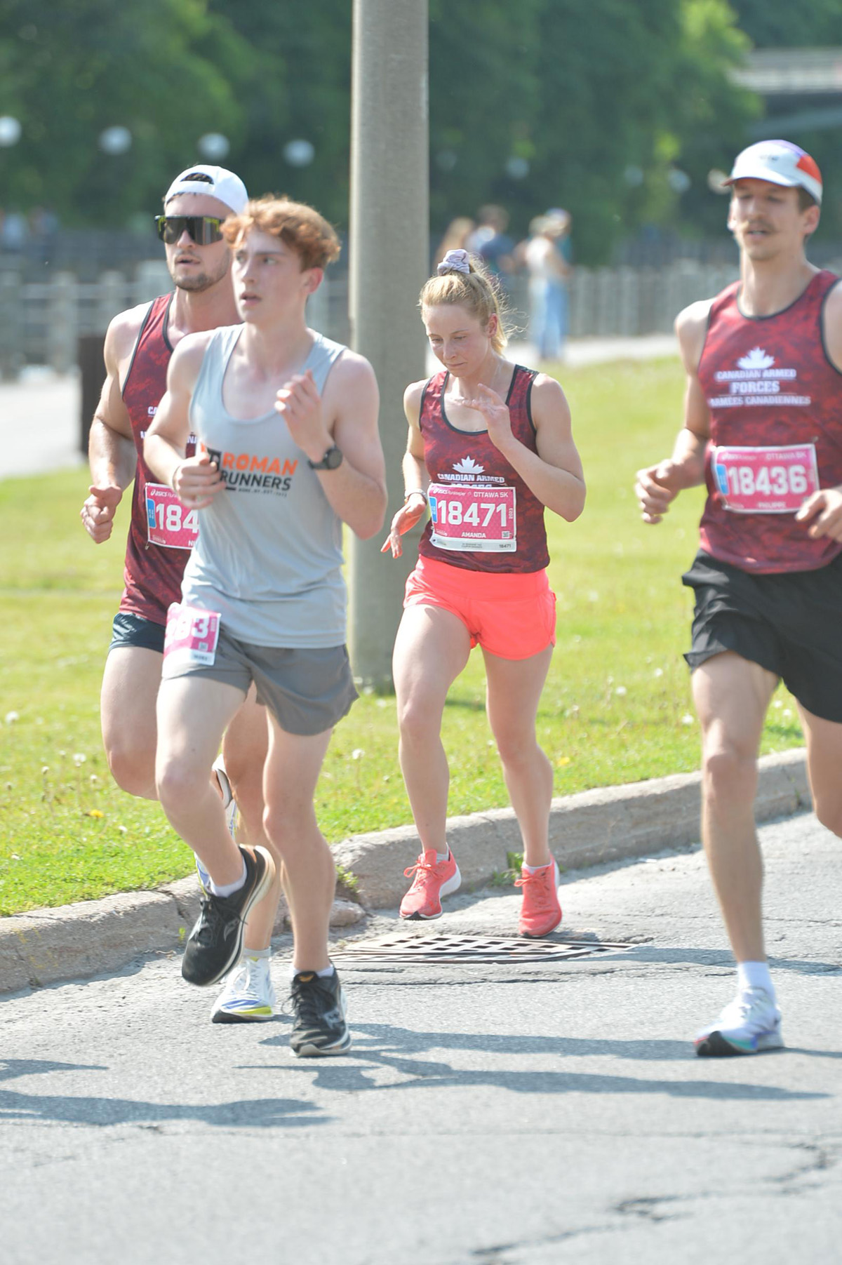 Sailor First Class Amanda Polus (centre) finished second in the CAF Female category in the 5K.