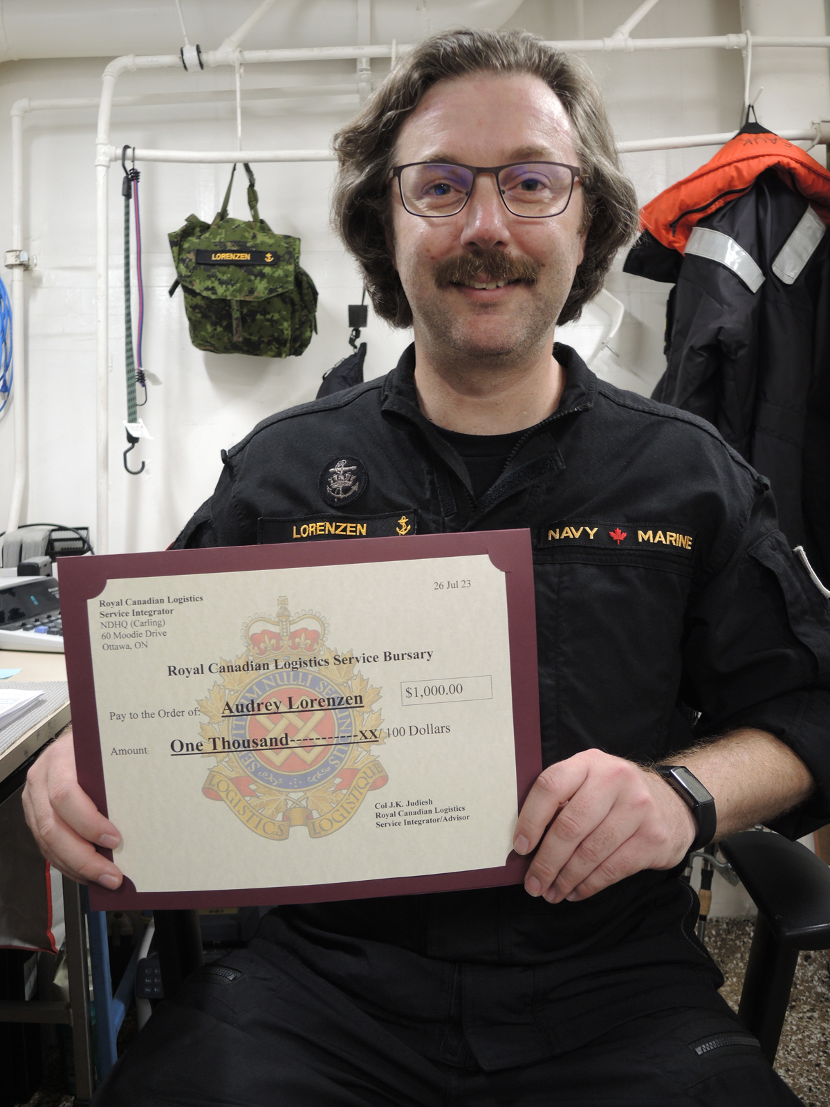 Petty Officer Second Class Kenneth Lorenzen displays his award from the Royal Canadian Logistics Service (RCLS) Fund Bursary Program. Credit: Peter Mallett/Lookout