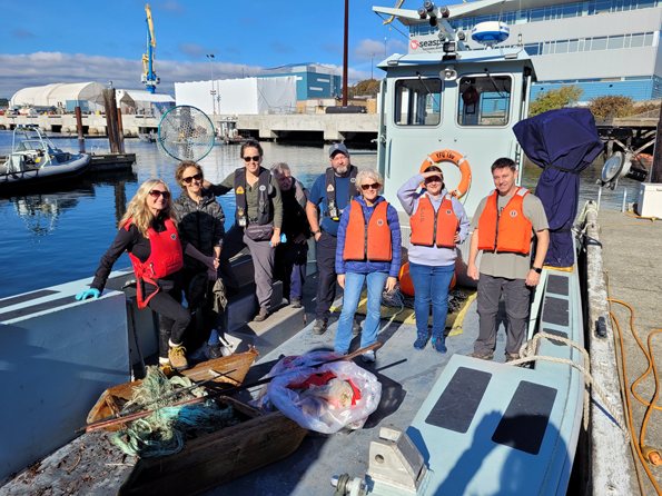 Members of the Harbour Shoreline Cleanup team gather at the Small Boats Jetty in Naden for a group photo following the successful completion of their mission.
Photos: Peter Mallett/Lookout Newspaper