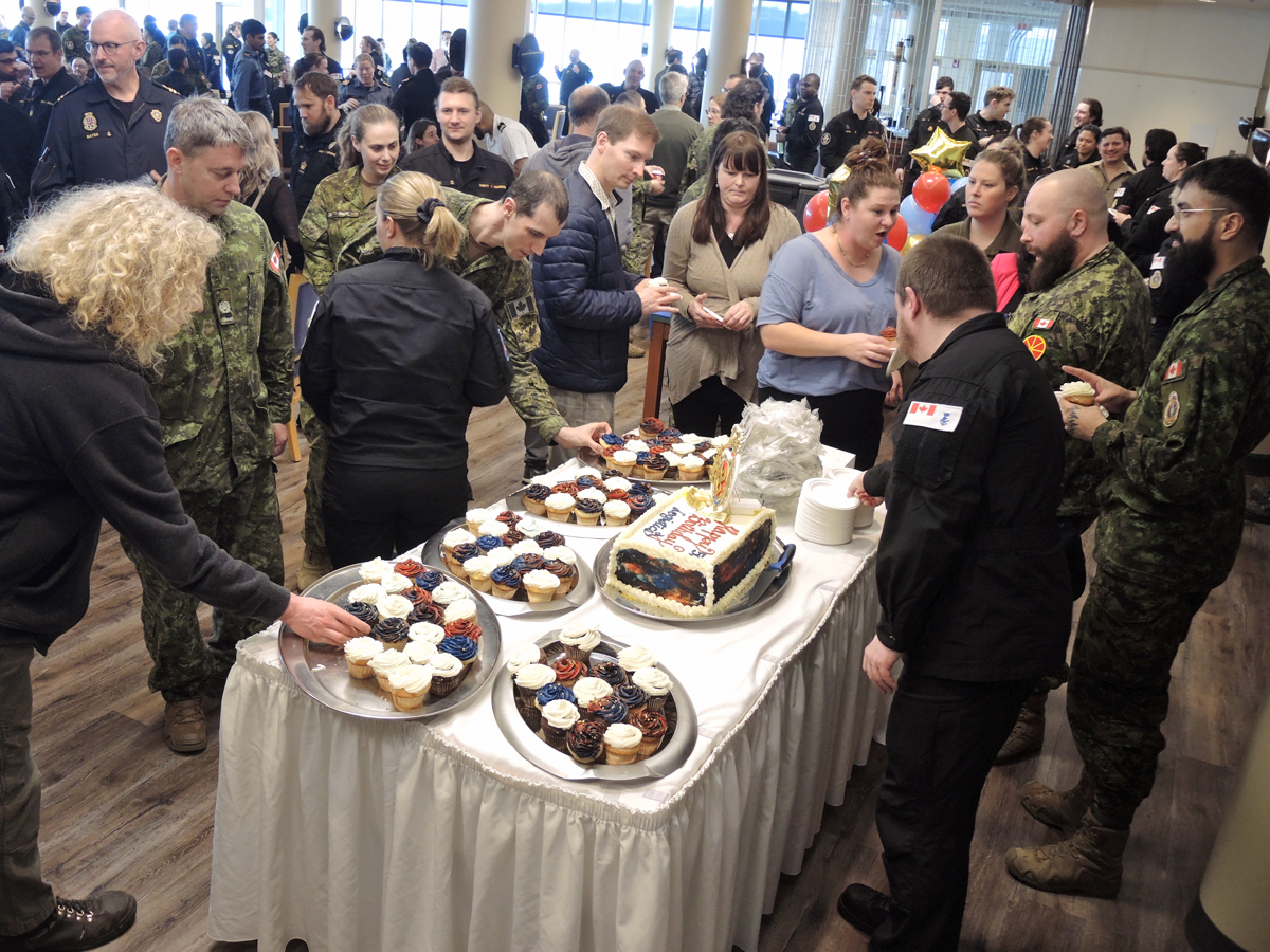 Members of the Base Logistics team gather for cake and refreshments at the Chief and Petty Officers' Rainbow Room during a 56th Anniversary party for the Royal Canadian Logistics Service on Feb. 1.