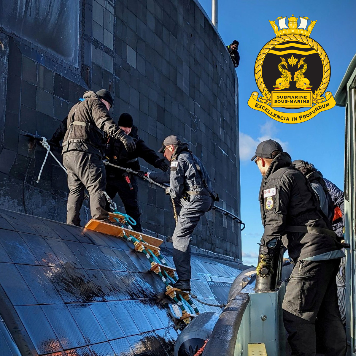 Members of CANSUBFOR HQ Det Halifax deliver mail, rations, and personnel to HMC Submarine Windsor in Halifax Harbour, with support from Canadian Forces Auxiliary Vessel Granville. Photo: Lt(N) Halerewich.