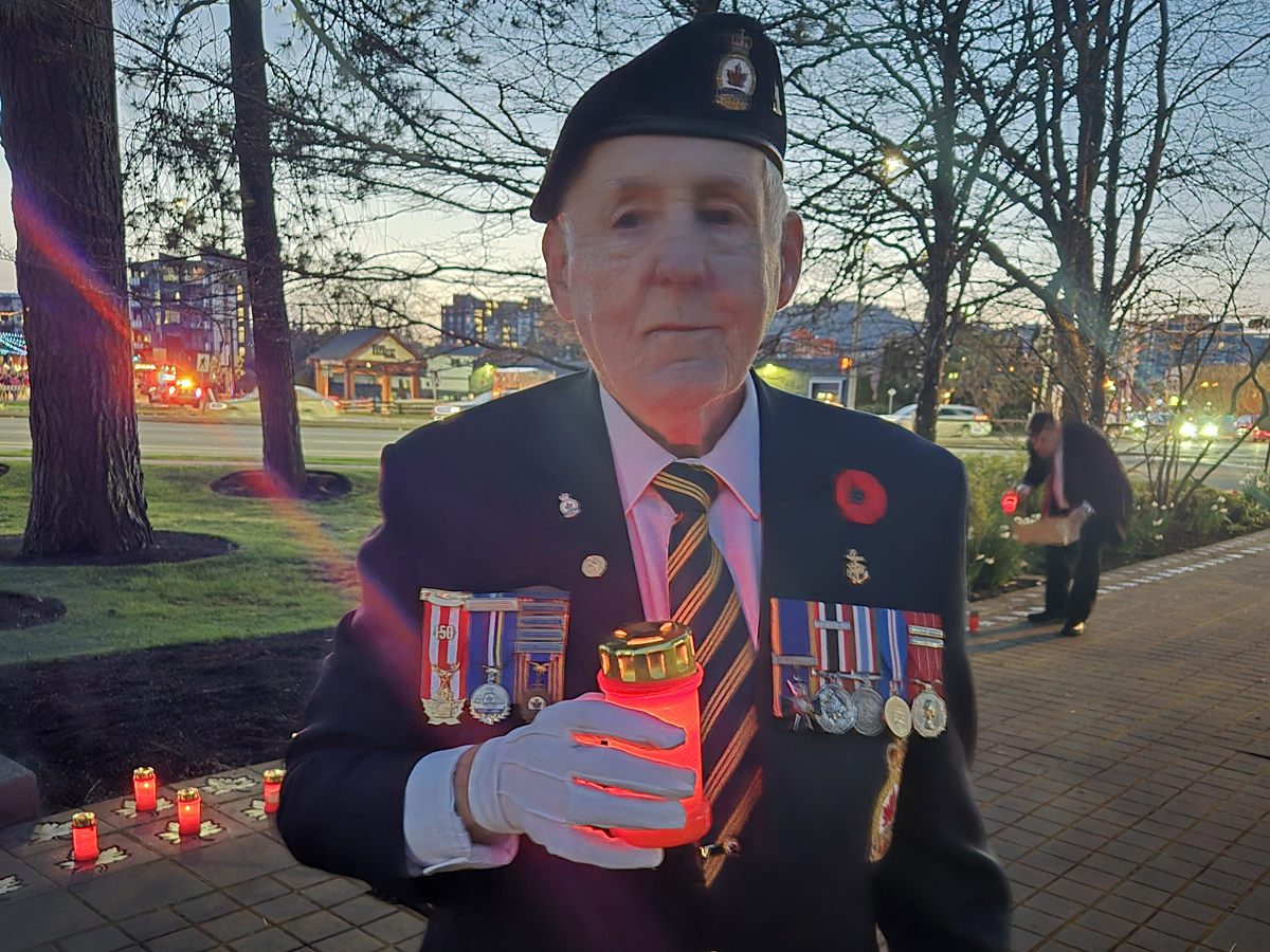 Top: Chief Petty Officer 1st Class (ret’d) John Robert Bourdage holds a candle during a Battle of Vimy Ridge Candlelit Tribute, Apr. 9, at Veterans Memorial Park in Langford.
