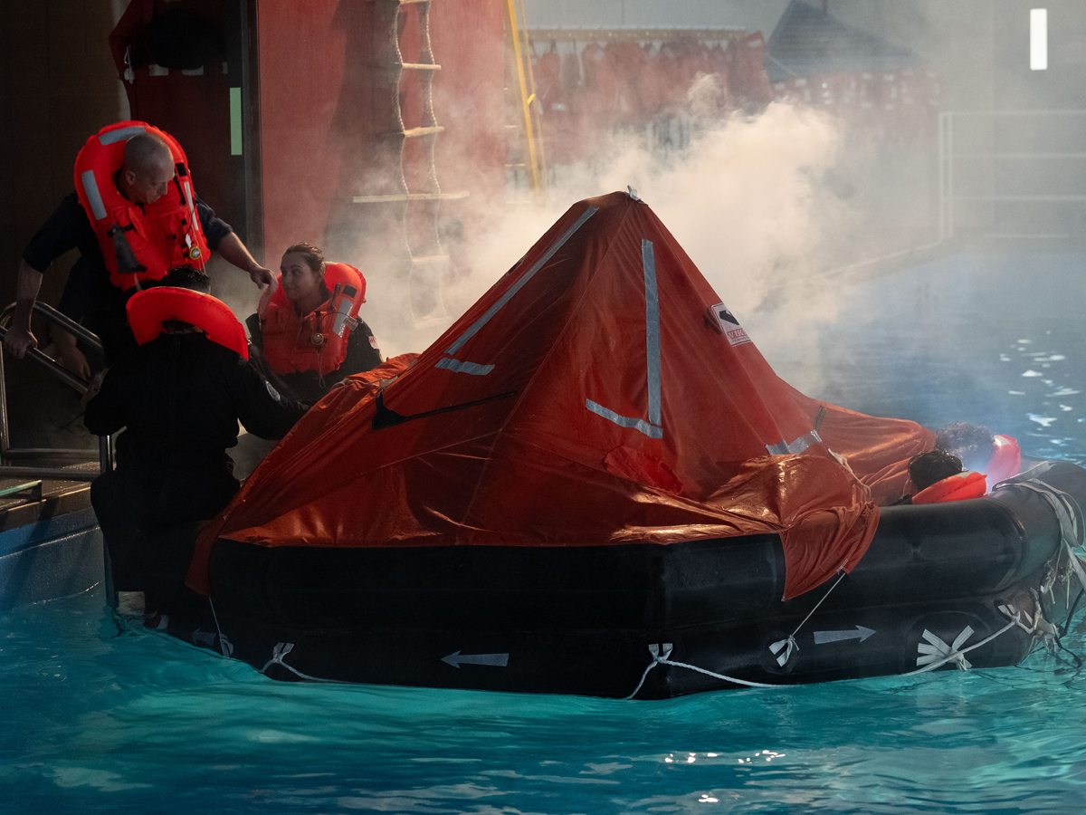 Sailors practice life raft entry procedures. Photos: MCpl Nathan Moulton