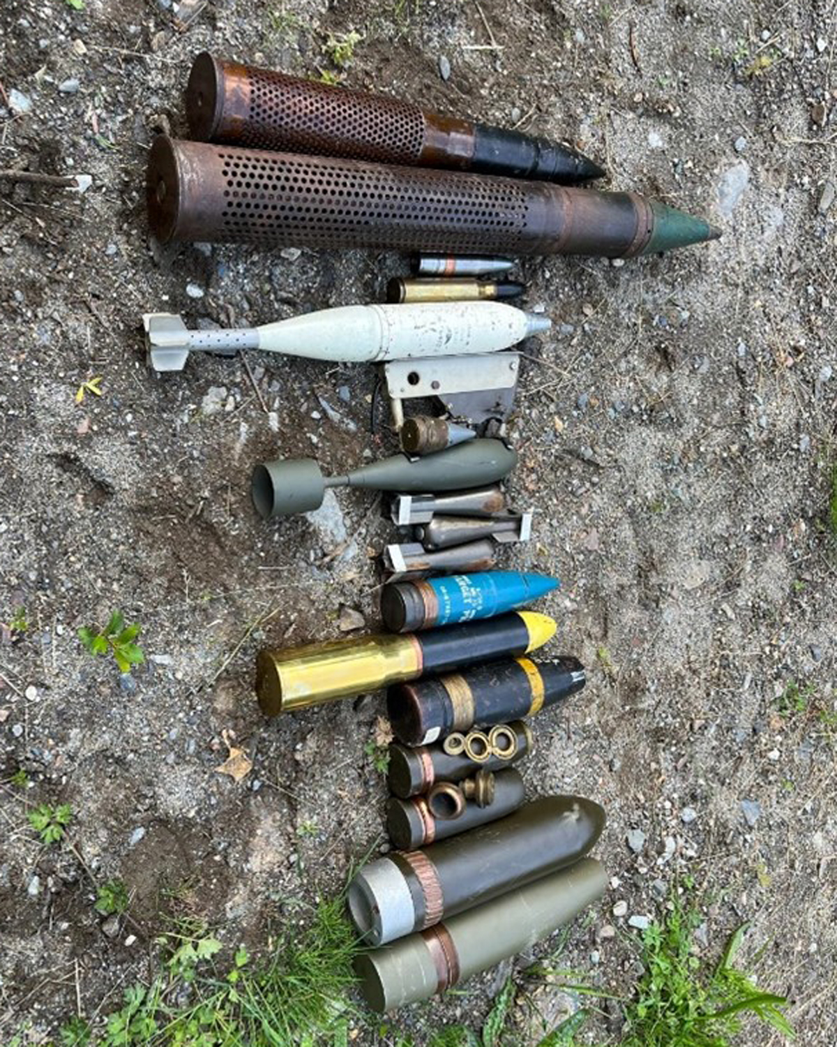 Some of the items the Explosive Ordnnce teams discovered while investigating a cache of munitions at a residential site in Mission, B.C. Photos supplied.