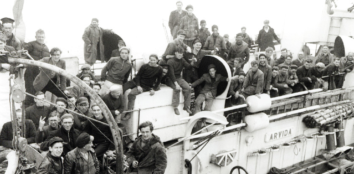Survivors from torpedoed merchant ship aboard HMCS ARVIDA Sep 14, 1942, St. John’s Harbour // Source: Lt Gerald M. Moses / Canada. Dept. of National Defence / Library and Archives Canada / PA-136285