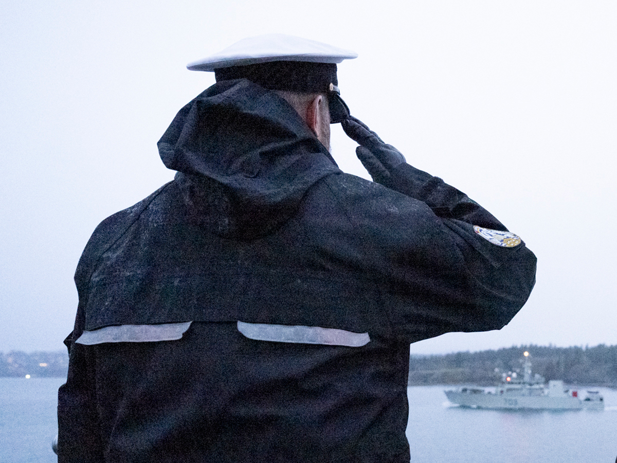 Rear-Admiral C. Robinson, Commander Maritime Forces Pacific salutes from Duntze Head. Photo by: Master Corporal Andre Maillet, MARPAC Imaging Services